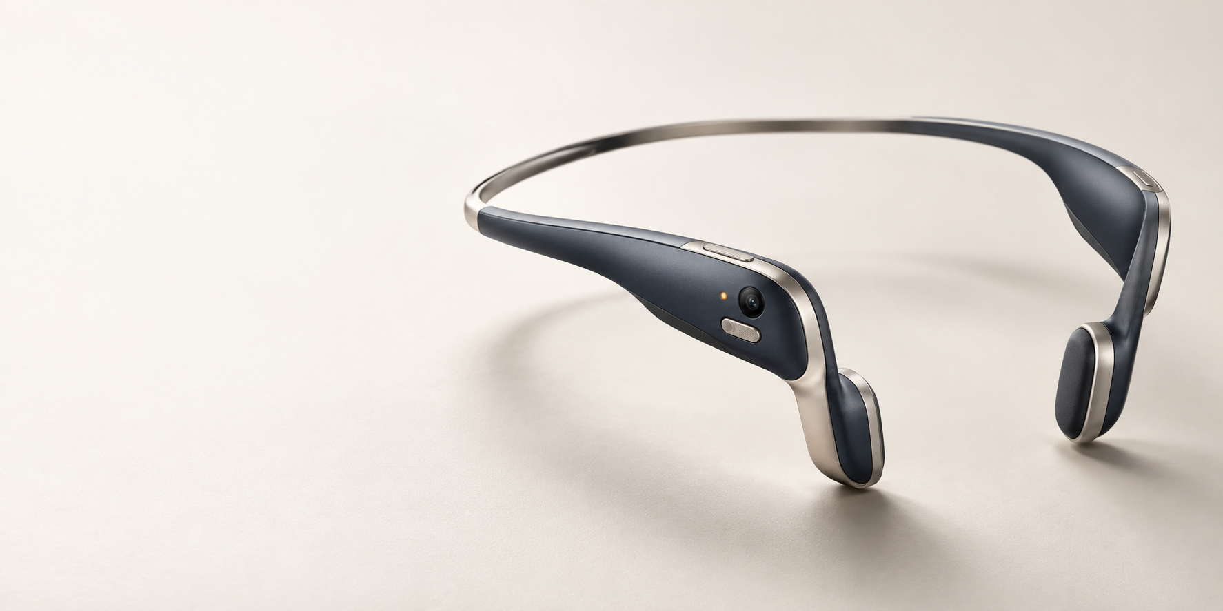 Concept rendering of a navy and titanium behind-head, open-ear Smart Brain wearable with a small camera